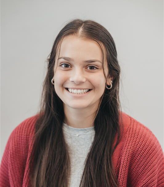 Professional headshot of Alli Escott