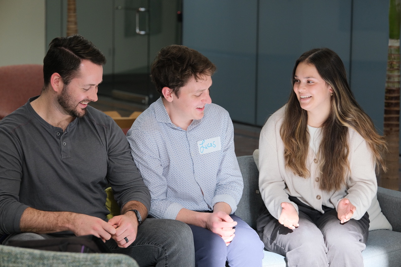 Three people discussing in a group